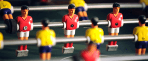 A picture of a table top football game called The Price of football shirts from kits for the world