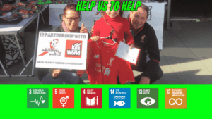 Child proudly holding a Liverpool FC shirt and certificate with adults supporting Kits for the World’s partnership with Whizzkids United, promoting sustainable development through football and education initiatives aligned with SDGs.